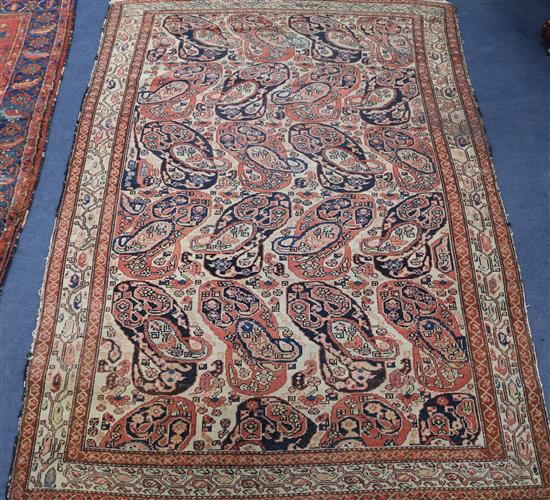 A Serabend rug with all-over boteh design in red, pink, blue and ivory, 195cm x 125cm
